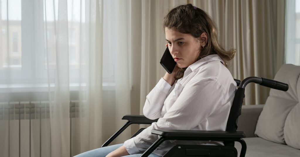 wheelchair phone frustrated angry sad