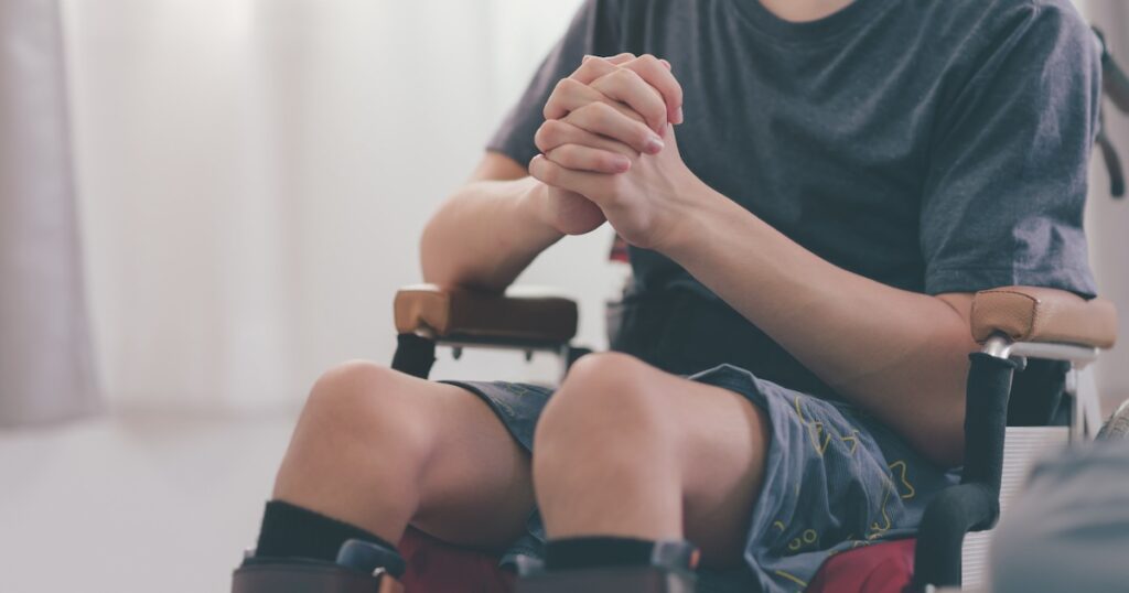 disability wheelchair praying